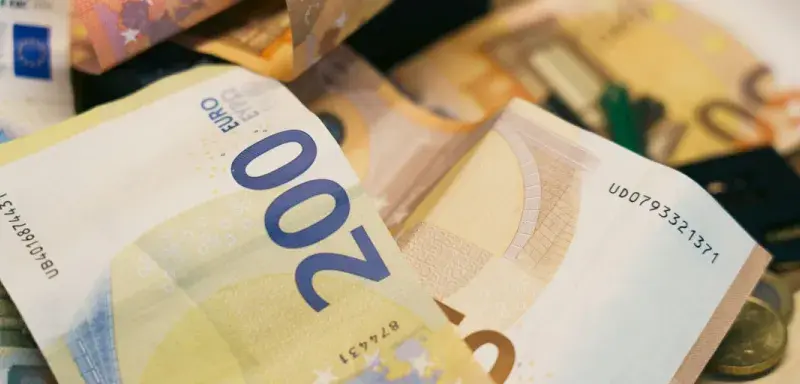 There is a pile of euro banknotes.