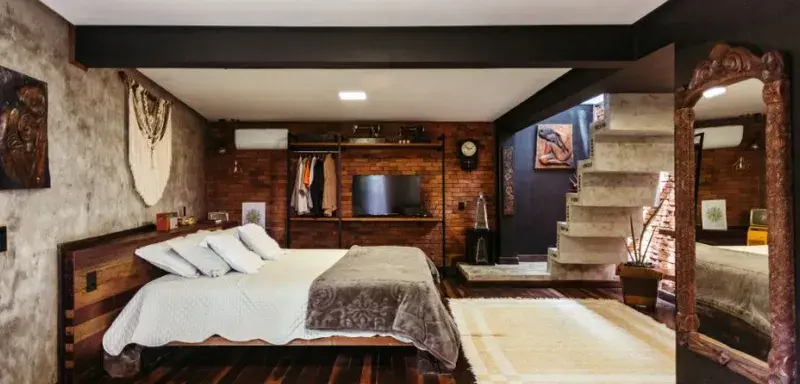 Cozy rustic modern bedroom with unique decor in Santa Teresa, Brazil.