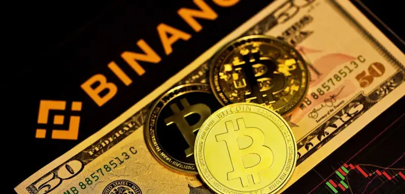 gold round coin on brown and black box
