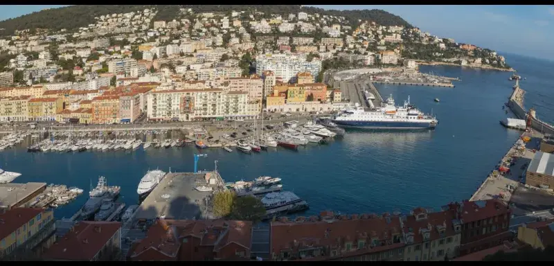 An aerial view of a coastal city's harbor.