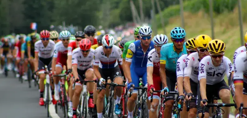 group of men riding bicycle
