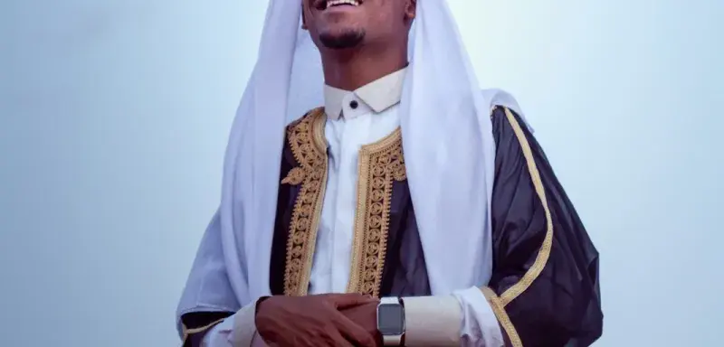 a man wearing a white and black outfit