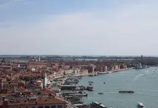 Aerial view of Venice showing the city's famous waterfront and architecture on a clear day.