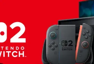 Console Nintendo Switch 2 posée sur une table, avec ses manettes Joy-Con détachées