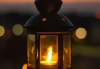 black lantern with fire during night time