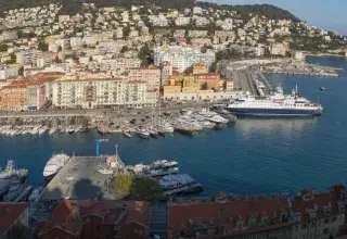 An aerial view of a coastal city's harbor.