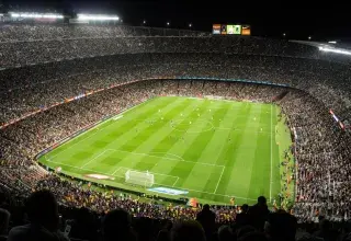 people watching soccer game in stadium