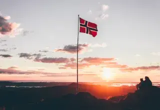 Norway flag standing on cliff