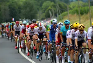 group of men riding bicycle