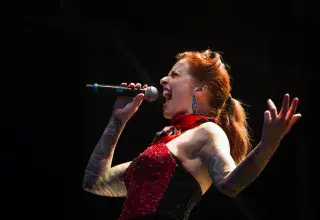 woman singing on wireless microphone