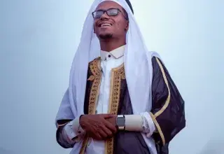 a man wearing a white and black outfit