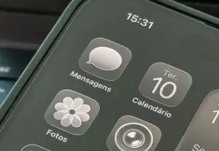 Close-up shot of a smartphone displaying apps and calendar on the screen.