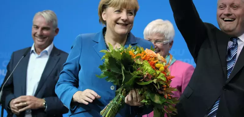 « La chérie de l'Allemagne », titre le quotidien Berliner Morgenpost, sur une photo d'Angela Merkel tout sourire... (Xinhua)